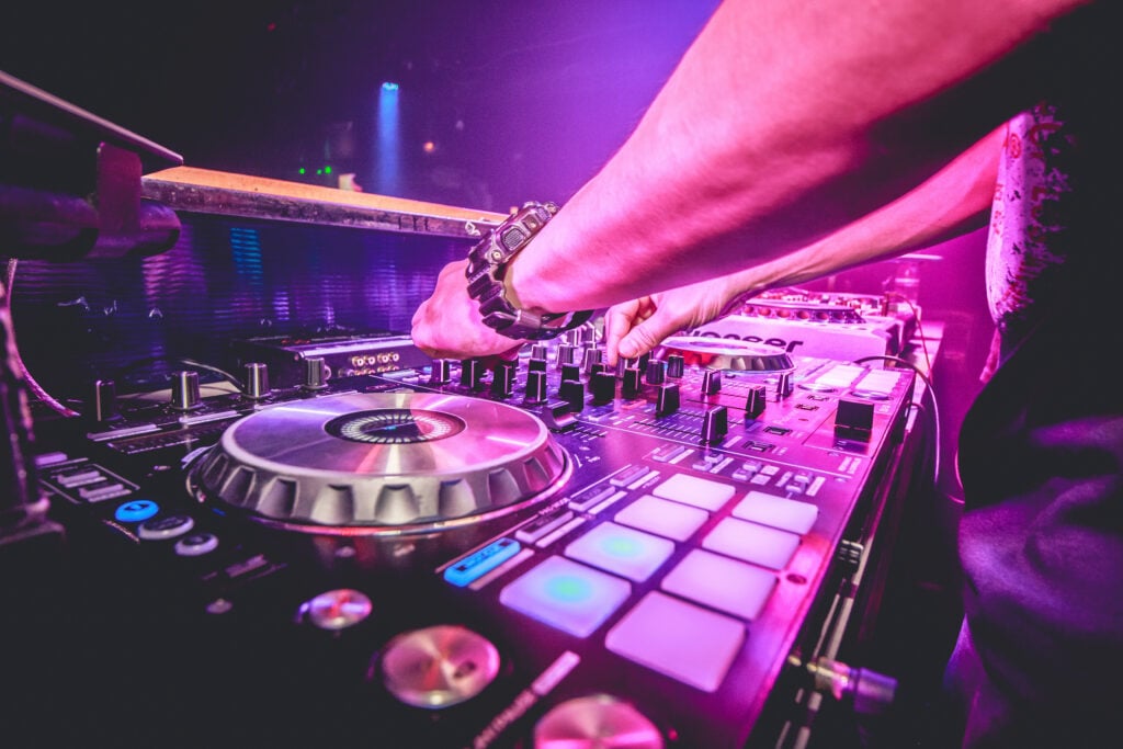 DJ mixes the track