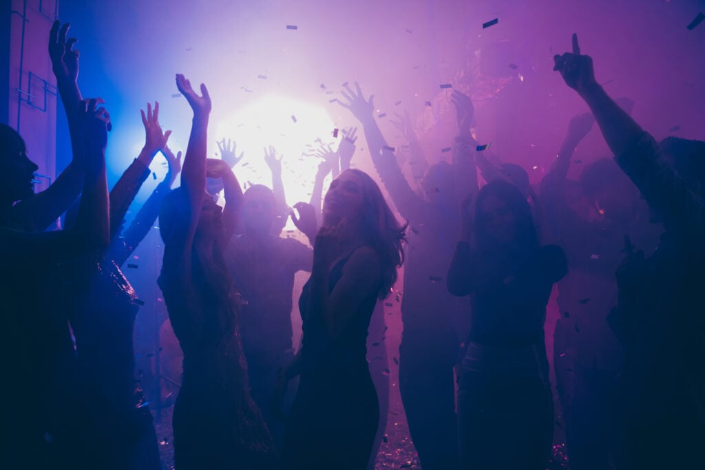 Nice attractive stylish cheerful cheery positive carefree guys ladies having fun hanging out best summer year student festive in new cool bar modern place indoors
